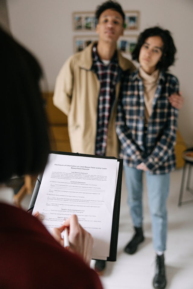 Couple completing rental application